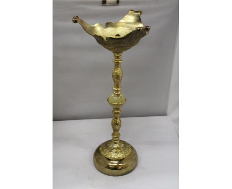 A LARGE POSSIBLY ECCLESIASTICAL BRASS CANDLESTICK WITH MARBLE TO THE MIDDLE, HEIGHT 56CM 