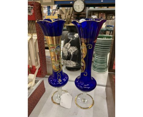 A PAIR OF VINTAGE BOHEMIAN COBALT BLUE GLASS VASES WITH HAND PAINTED FLORAL DECORATION 