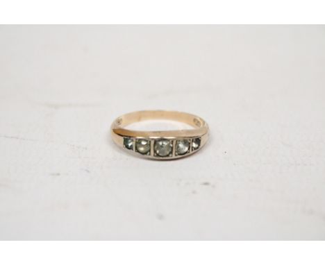 A 9 CARAT GOLD RING WITH FIVE IN LINE STONES GROSS WEIGHT 1.4 GRAMS 