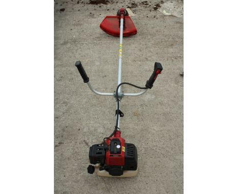 A PETROL ENGINE GRASS STRIMMER 