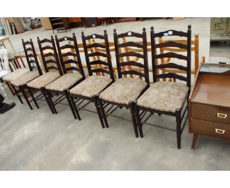 A SET OF SIX OAK LADDER BACK DINING CHAIRS 