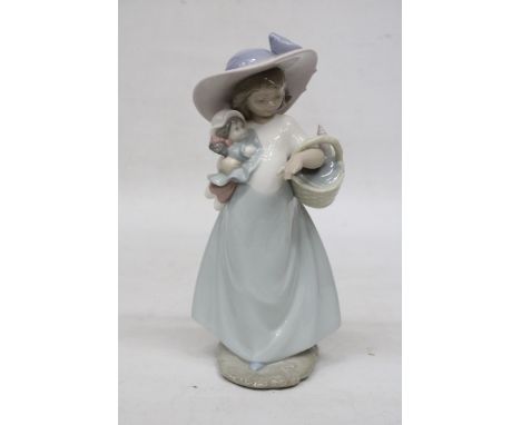 A NAO FIGURE OF A GIRL WITH A DOLL AND A BASKET 