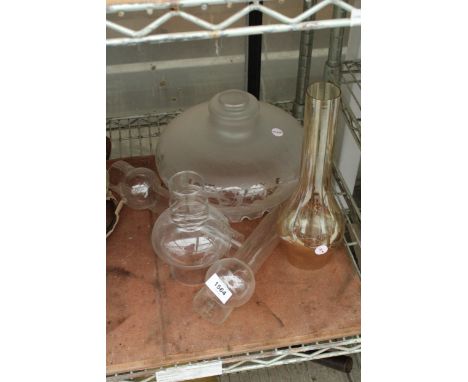 AN ASSORTMENT OF GLASS OIL LAMP SHADES AND FUNNELS 