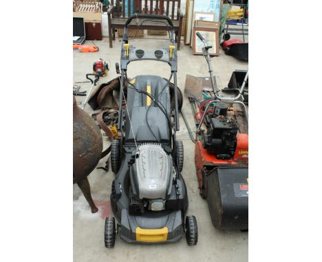 A BMC ROTARY PETROL ENGINE LAWNMOWER WITH GRASS BOX 