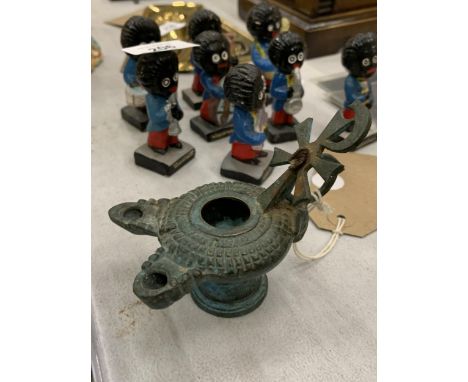 A POSSIBLE BRONZE, ROMAN OR BYZANTINE, OIL LAMP 