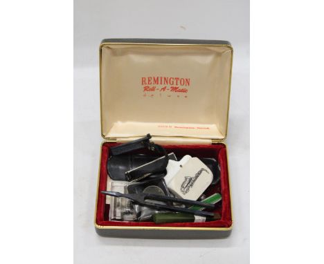 A SMALL QUANTITY OF MUSICAL ITEMS TO INCLUDE A STAGG CAPO, A MAESTRO PITCH PIPE, A TUNING FORK ETC IN A REMINGTON ROLL-A-MATI