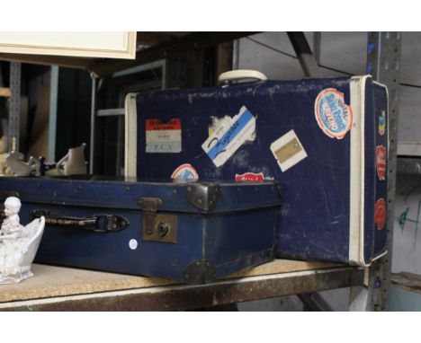 TWO VINTAGE BLUE SUITCASES - ONE WITH STICKERS FROM VARIOUS HOTELS 