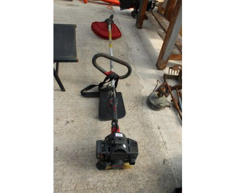 A KAWASAKI PETROL ENGINE GRASS STRIMMER 
