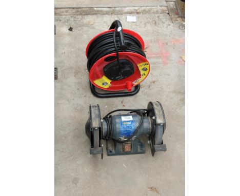 A NUTOOL BENCH GRINDER AND AN EXTENSION LEAD 