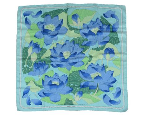 Hermes, Fleurs De Lotus, a silk scarf, designed by Christiane Vauzelles, with a pale blue background with lotus decoration, w