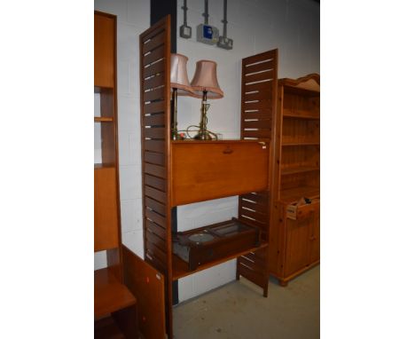 A vintage teak ladderax wall unit, with cocktail section, approx. dimensions W93 D39 H200cm, few scrapes and marks, some vene