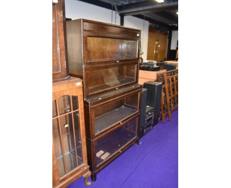 A vintage dark oak four tier stacking bookcase, labelled Gunn, width approx. 87cm, height 157cm