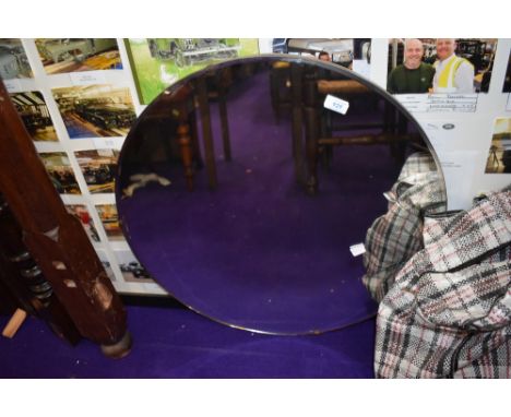 A circular hall way mirror with bevel edged glass, diameter approx. 61cm, a few light scratches should polish out