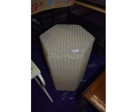 A vintage Lloyd Loom hexagonal laundry basket
