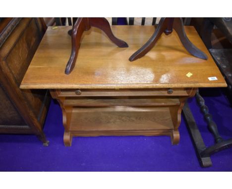 A light oak coffee table with integral drawer 80cm wide by 46cm deep by 55cm tall