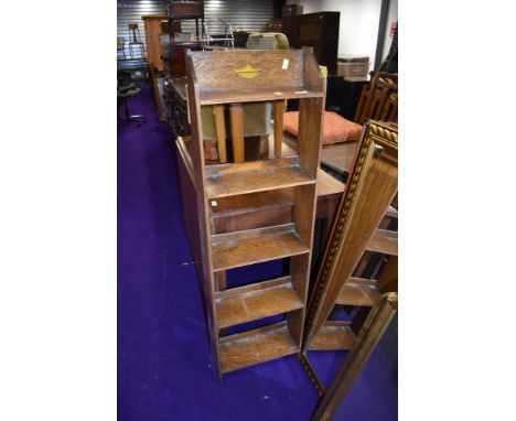 An Edwardian narrow oak book shelf approx 50cm wide