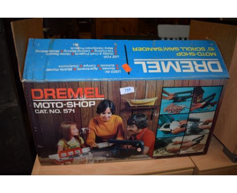 A vintage Dremel moto shop scroll saw/sander in original box