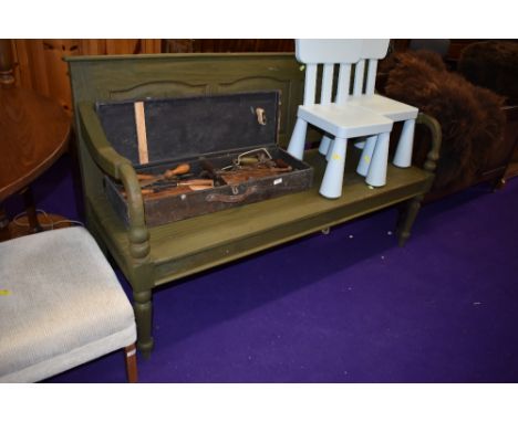 A two seater wooden garden bench