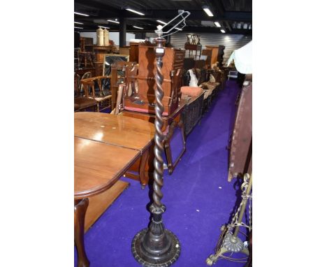 a large standing standard lamp having barley twist stem