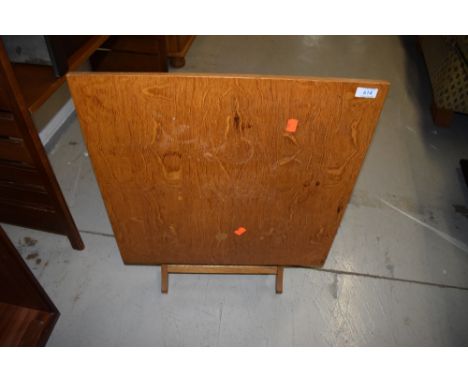 A vintage golden oak folding table