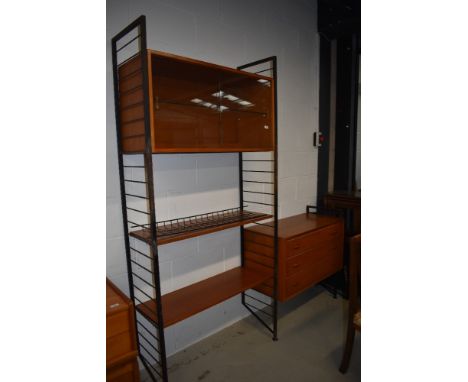 A vintage metal frame ladderax shelf unit with glazed display and three drawer sections