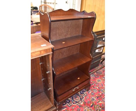 A mahogany shelf with drawer set