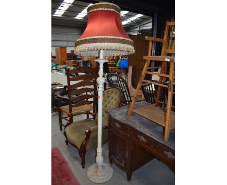 A traditional painted standard lamp