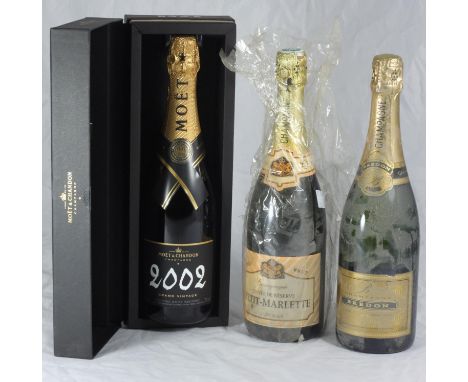 Three bottle of Champagne comprising 1x bottle of Moet &amp; Chandon 2002 Grand Vintage, boxed, together with 1x bottle of Pe