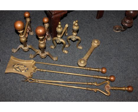 Two pairs of brass fire dogs, a set of three fire tools, etc