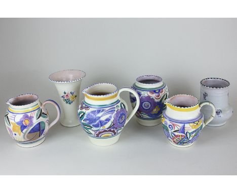 A collection of six Poole Pottery jugs and vases (a/f - one with repaired handle)