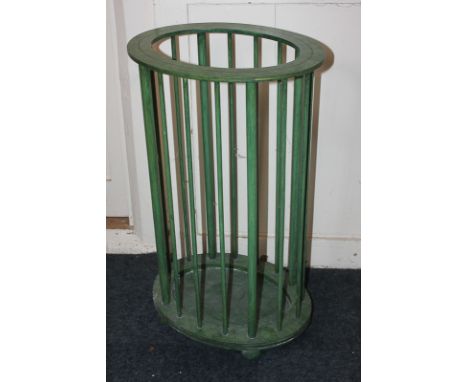 A green oval stick stand, 66cm high