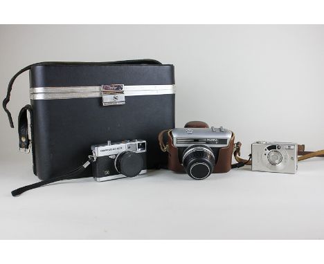 A Carl Zeiss Jena Werra 3 camera in fitted Werra leather case, an Olympus 35 ECR camera and a Canon Ixus II, together with a 