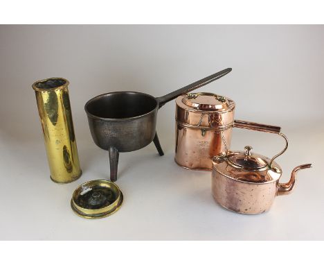 A bronze five pint pan on three legs, a brass shell casing, with worn etched detail dated 1916, Gen. French, Gen. Haig and Ge