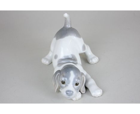 A Lladro porcelain model of a puppy, 11cm high