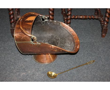 A copper coal scuttle, together with a brass ladle