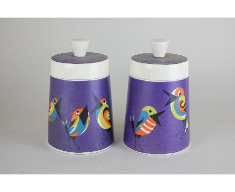 A pair of Goebel vintage pots and covers, cylindrical shape, decorated with colourful bird characters on a purple ground, 16c