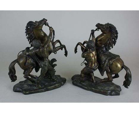 After Guillaume Coustou (1677-1746), a pair of bronze Marly horses, both signed Coustou, 23.5cm high