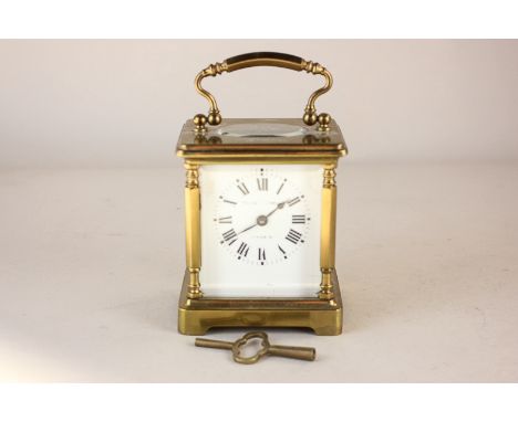 A Mappin & Webb brass carriage clock with white enamel dial and Roman numerals, 13cm