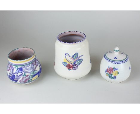 Three pieces of Carter Stabler Adams Poole Pottery including a vase depicting a bird, a smaller vase and a jam pot and cover