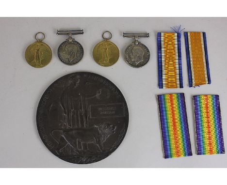 A pair of First World War medals and bronze death plaque awarded to Frederick Parham (76200 GNR RA), together with a pair of 