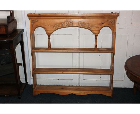 A pine three-tier wall shelf unit with Pears Soap letter decoration, 94.5cm