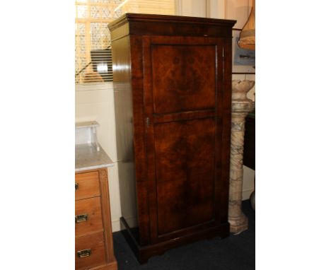 A Victorian mahogany and burr walnut small wardrobe with rail and shelf behind a panelled door, on bracket feet, 165cm high b