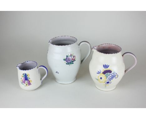 Three Carter Stabler Adams Poole Pottery jugs, all with floral design, various sizes