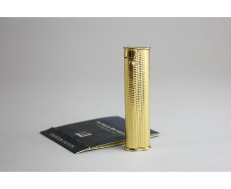 A Dunhill engine turned cigarette lighter, 20 microns, together with a packet of Dunhill  lighter flints (3 missing)