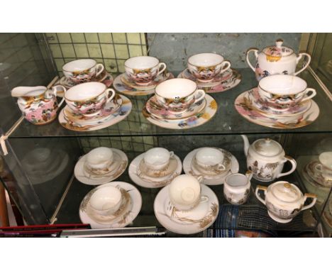 JAPANESE EGGSHELL PORCELAIN TEA SERVICE AND A SIMILAR SERVICE WITH GEISHA PORTRAIT HEAD MEDALLIONS TO BASE OF CUPS A/F