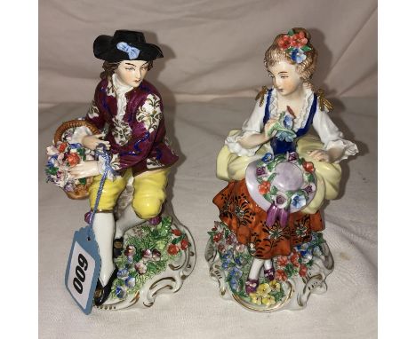 PAIR OF SITZENDORF PORCELAIN FIGURES IN THE 18TH CENTURY ROCOCO STYLE OF SEATED MALE AND FEMALE COMPANIONS WITH BASKET OF FLO