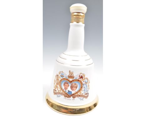 1 x 75cl (1981) bottle of Bells Scotch Whisky, in a commemorative Porcelain decanter in the shape of a Bell, with an image of