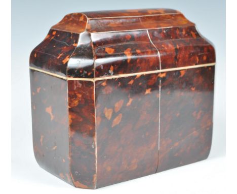 An early 19th century George III tortoiseshell &amp; ivory banded tea caddy of sarcophagus form with line silver inlays. The 