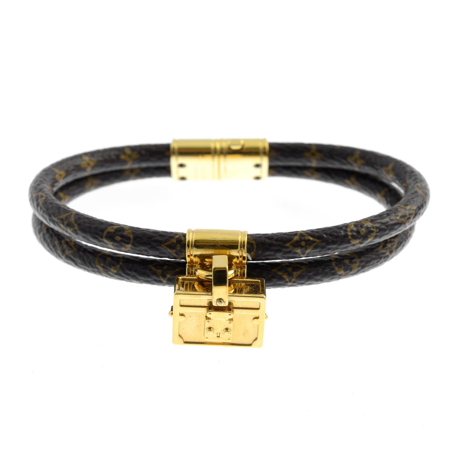 LOUIS VUITTON - a &#39;Monogram Keep It Twice&#39; leather bracelet. Designed as a double band, with lugg