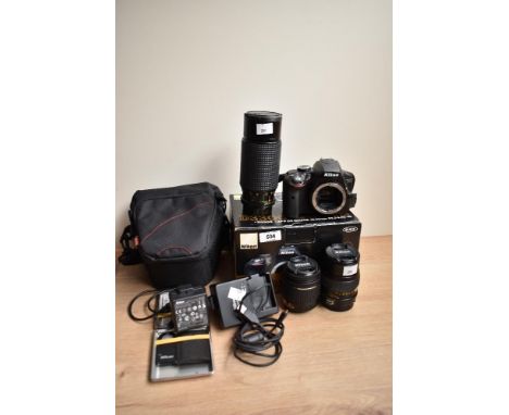 A Nikon D3300 digital camera with Nikon AF-P DX Nikkor 1:3,5-5,6G VR 18-55mm lens, and Bell &amp; Howell 1:2,8 135mm len. Cam